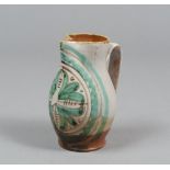 CARAFE IN MAJOLICA, CENTRAL ITALY LATE 19TH CENTURY

white, green and brown glazing, with floral