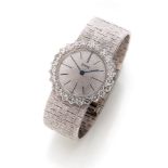 FINE LADY'S WRIST WATCH

entirely in white gold 18 kt., oval case with diamond surround. Signed