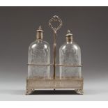LIQUOR SET IN SILVER AND GLASS, PROBABLY ENGLAND EARLY 20TH CENTURY

with two engraved bottles.
