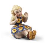 FIGURE OF GIRL IN CERAMIC, EARLY 20TH CENTURY
polychrome glazing. The figure is sitting and