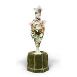 REMAINS OF VASE IN CERAMIC, PROBABLY FRANCE, EARLY 20TH CENTURY
design in relief of blossom. With