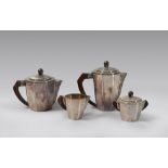 TEA AND COFFEE SET IN SILVER, CALDERONI MILANO 1940s
with elements in polygon shape and wooden