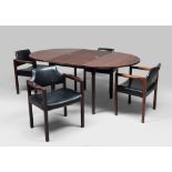 TABLE AND FOUR ARMCHAIRS, 1960s
in rosewood. Table with round extendable top, armchairs with black