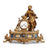 TABLE CLOCK IN ORMOLU, 19TH CENTURY
face case with allegory of dancing figure. Base with tiles in