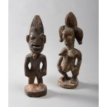 PAIR OF SCULPTURES OF ANCESTORS, YORUBA NIGERIA 20TH CENTURY
in wood. The figures are nude and