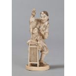 SCULPTURE IN IVORY, JAPAN, LATE 19TH, EARLY 20TH CENTURY
depicting a scene of matsuri with child