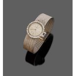 ELEGANT LADY'S WRIST WATCH
entirely in white gold 18 kt., surrounded by diamonds. Satinized