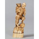 SCULPTURE IN MARINE IVORY, JAPAN, LATE 19TH-EARLY 20TH CENTURY
depicting a farmer with basket and