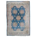 KIRMAN RUG, MID 20TH CENTURY five medallions with floral design and secondary motifs with flowers