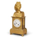 FINE CLOCK IN ORMOLU, FRANCE EARLY 19TH CENTURY
with upper classical torso. Face in white enamel