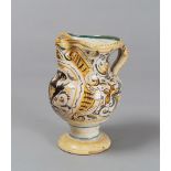 JUG IN MAJOLICA, PESARO PROBABLY CASALI E CALLEGARI 17TH CENTURY

white, brown and ochre glazing,