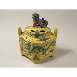 CHINESE INCENSE BURNER.
A Chinese porcelain, yellow ground incense burner, decorated in famille