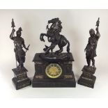 CLOCK GARNITURE.
A 19th century black slate clock garniture, with spelter figures. Max. height 49cm,