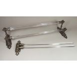 TOWEL RAILS.
Two metal mounted glass towel rails. CONDITION REPORTS: The 'two stepped' towel rail is