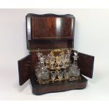 LIQUEUR DECANTER BOX.
An Edwardian burrwood, ebonised & strung liqueur decanter box, the