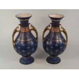 METTLACH.
A pair of large Mettlach vases. Impressed stamp & numbered 1900. 
Height 38cm. CONDITION