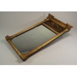 MIRROR.
A 19th century gilt wood small mirror, with reverse painted landscape panel.
Height 58cm,