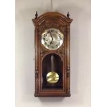 WALL CLOCK.
An early 20th century walnut cased, striking wall clock. Height 78cm. CONDITION REPORTS: