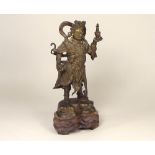 ORIENTAL BRONZE.
A Chinese bronze figure of a warrior. Pierced hardwood base.
Height without base