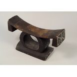 AFRICAN HEADREST.
A decorated African headrest, with inlaid beadwork decoration. Width 27 x height