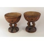 AFRICAN BOWLS.
A pair of carved & decorated African pedestal bowls, 19cm. CONDITION REPORTS: Both