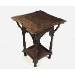 INDIAN TABLE
An Indian carved hardwood table, the top with carved figural supports.
Height 62cm.