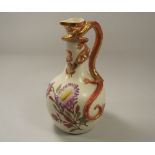 ROYAL WORCESTER EWER.
A Victorian, Royal Worcester, shape 260 ewer, with dragon handle. Puce back