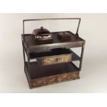 JAPANESE TOBACCO BOX.
A Japanese lacquered tobacco box (Tabaco-dan), with swing copper handle, a