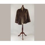 FAUX FUR.
A 1940's 'Minkaleen' faux fur cape. CONDITION REPORTS: This Minkaleen jacket/cape is in