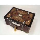 JEWELLERY CASKET.
A Victorian burrwood jewellery casket, ebonised & inlaid with bone & abalone.