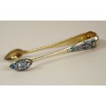 RUSSIAN TONGS.
A pair of late 19th century Russian, silver gilt & enamelled sugar tongs. Stamped