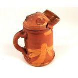 PETER SMITH.
A Peter Smith slip decorated lidded jug. Seal marks. Height 19cm.  CONDITION REPORTS: