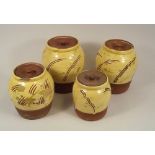 WILLIAM MARSHALL.
Four William Marshall slipware, sgriffito decorated lidded jars. All with