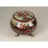 COLIN KELLAM.
A Colin Kellam lidded jar on four feet. Impressed marks. Height 12cm, max. diameter