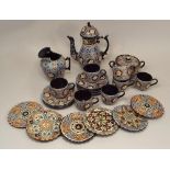 THOUNE POTTERY.
A Thoune Pottery coffee service & six small shaped plaques. Coffee pot 23cm, plaques