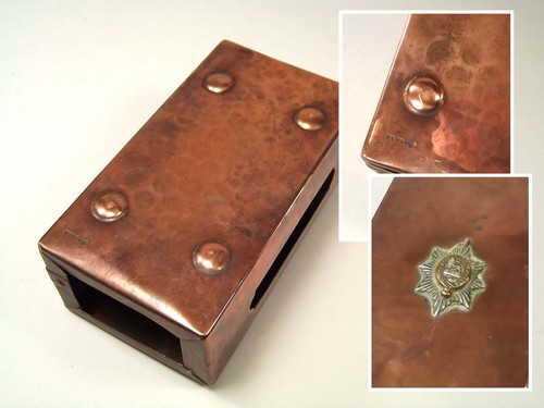 NEWLYN COPPER.
An extra-large Newlyn copper match box cover with an applied Regimental crest for the - Bild 3 aus 3
