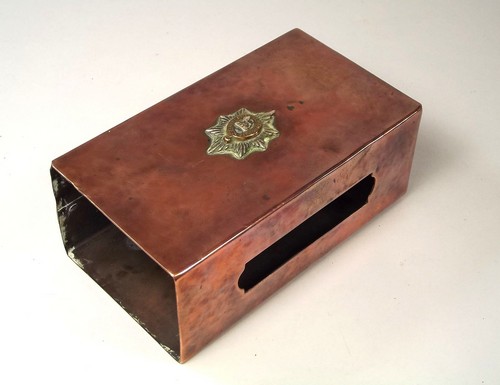 NEWLYN COPPER.
An extra-large Newlyn copper match box cover with an applied Regimental crest for the