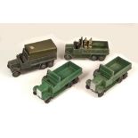 DINKY TOYS.
Military models: Four six-wheel wagons. 
Note: Detailed, individual condition