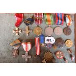 A collection of Polish medals and badges including Polonia Restitute, Long Service, 1921 medals with