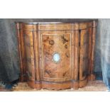 A nice quality Victorian shaped serpentine credenza in well figured walnut.  The inlaid frieze