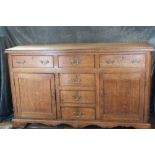 Desirable C18th honey coloured oak sideboard.  Two large drawers either side of three further