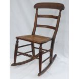 Child's rocking chair with slat back and cane seat