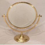 Circular brass swivel table mirror, 33cm diameter