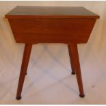 Wooden 1960's retro sewing box on four splayed legs, hinged lid with black top, 42cm wide