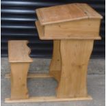 Child's pine desk, sloping front with hinged top, integrated with bench seat