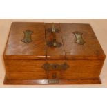 Oak twin compartment cigar & cigarette box, with brass handle, drawer for matches and key, 26cm