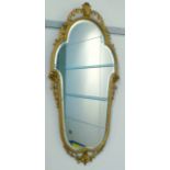 Shaped wall mirror with floral and acanthus carved gilt frame, 94x46cm