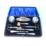 George V manicure set comprising seven pieces marked WG Sothers Birmingham 1918, and two pairs of