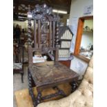 A NORTH COUNTRY CARVED HALL OAK CHAIR WITH BARLEY TWIST LEGS AND STRETCHER