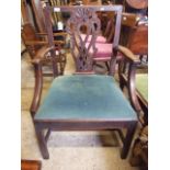 AN OAK WIDE OPEN ARMCHAIR WITH CARVED BACK, STRAIGHT FRONT LEGS, POSSIBLY  IRISH WITH LIFT OUT SEAT